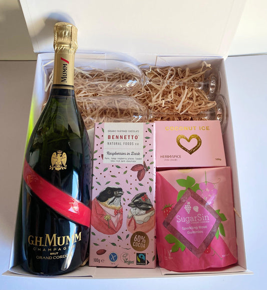 mumm 750ml champagne, Bennetto chocolate, coconut ice candy , watermelon lollies, 2x champagne glasses. all packaged in a magnetic box with ribbon and personalized message. gratefully gifted christchurch New Zealand 