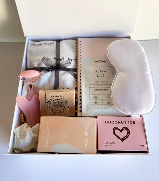 52 week planner, panna pink clay vegan soap, mindful tea and strainer,  glow lab sheet mask, white satin eye mask, rose quartz face roller amd sha gua, organic cotton heat pack, coconut ice candy all packed im a beautiful magnetic box with ribbon with personalized message, gratefully gifted christchurch New Zealand 